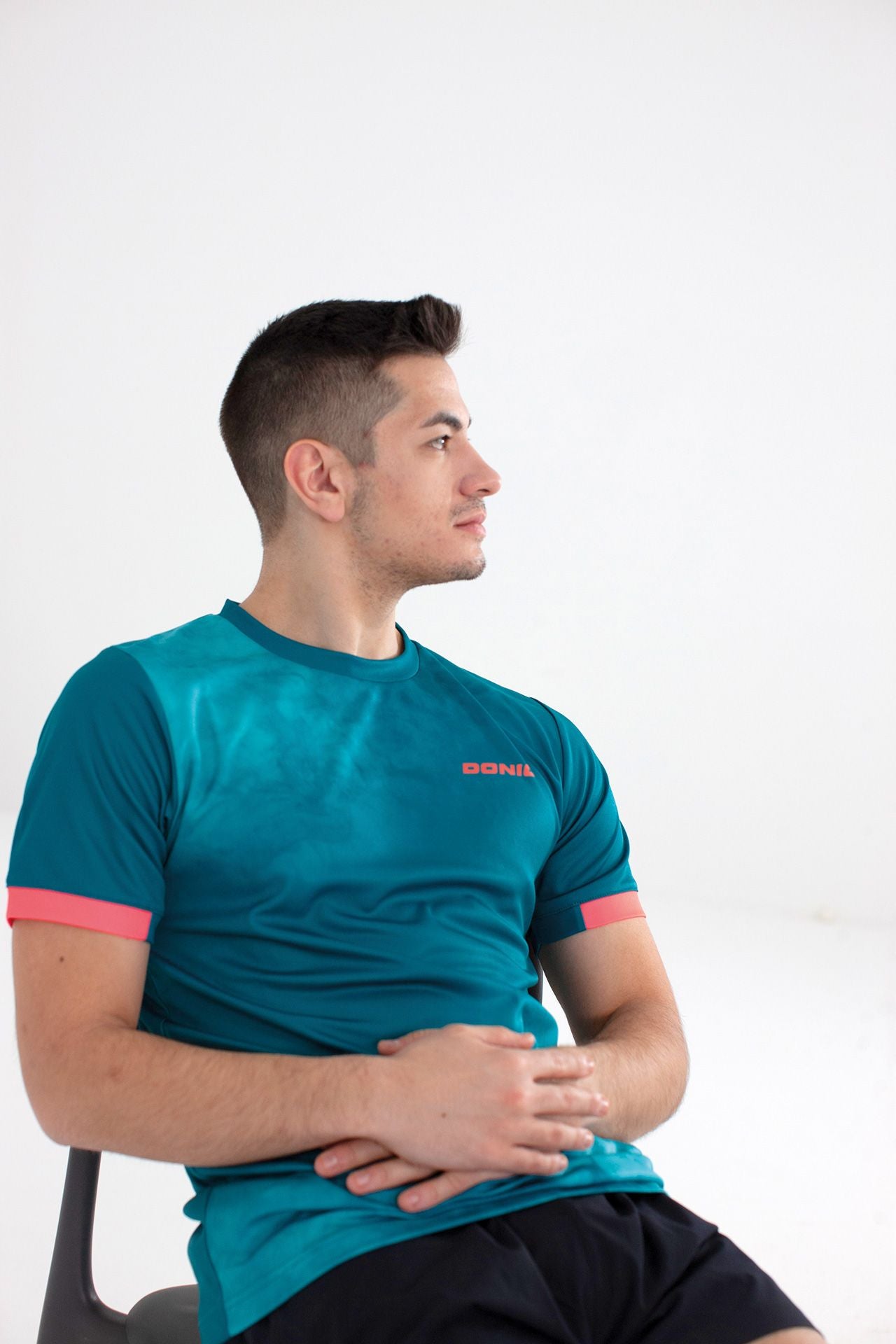 Donic T-Shirt Axtion Grün/Hellblau/Orange